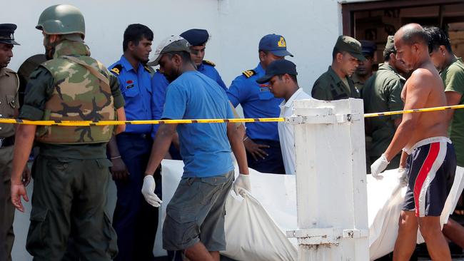 A body is removed from St Anthony's yesterday. Picture: Reuters