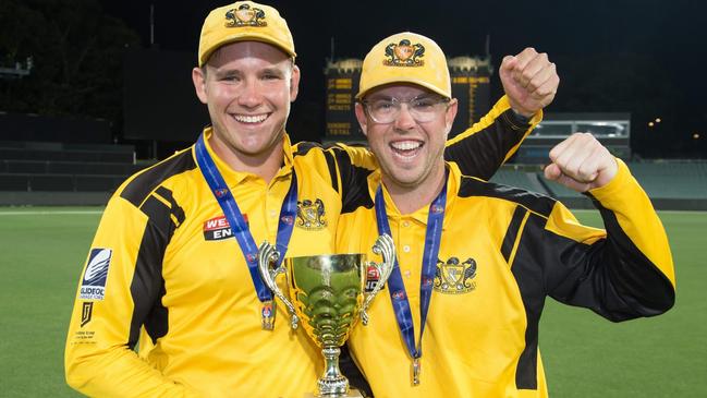 Glenelg captain Jake Winter (left) and Conor McInerney celebrate Glenelg's T20 Cup ttriumph this season. Picture: SACA.