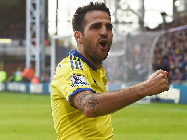 Chelsea’s Cesc Fabregas celebrates scoring his team's second goal during their English Premier League soccer match against Crystal Palace at Selhurst Park, London, Saturday, Oct. 18, 2014. (AP Photo/Tim Ireland)