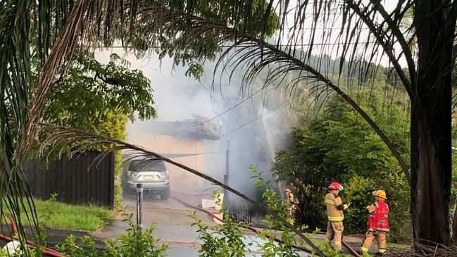 A car in the driveway of a house gutted by fire on Plantain Rd, Shailer Park PHOTO: Jeni Faulkner