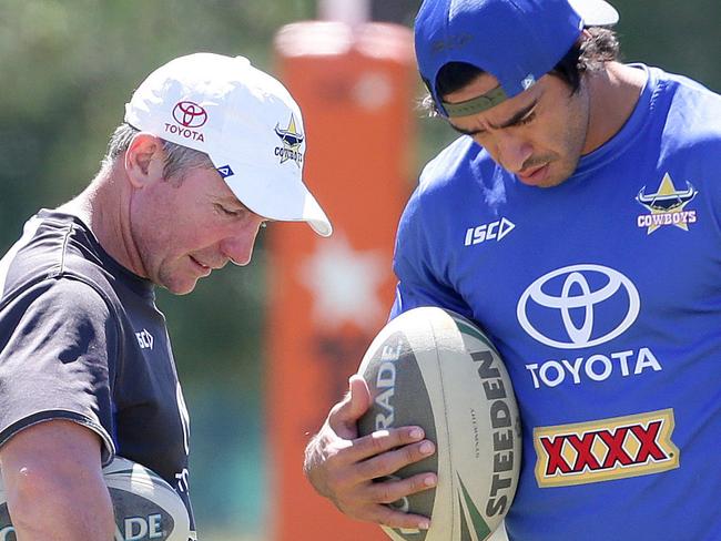 Johnathan Thurston talks with coach Paul Green at where he didn't take part in the training session with the North Queensland Cowboys at Royal Pines on the Gold Coast. Pics Adam Head