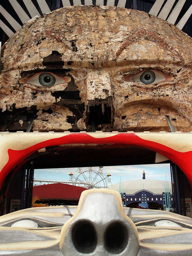 Mr Moon nearly home. The final pieces of Luna Park's Mr Moon face lie on the footpath out side Luna Park in St Kilda before it was restored in 1999. Picture: HWT Library.