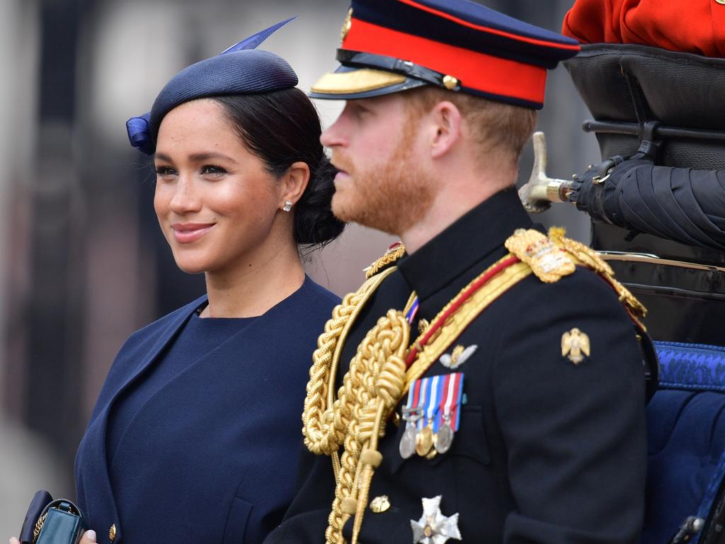 Britain's Meghan, Duchess of Sussex and Britain's Prince Harry, Duke of Sussex make their way in a horse drawn carriage to Horseguards parade. Picture: Getty