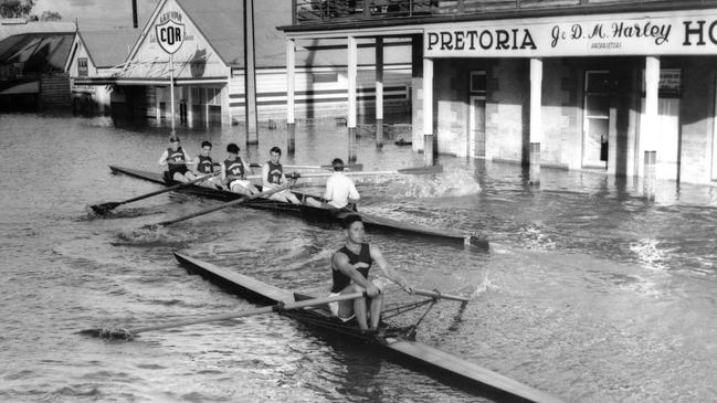 Rowers rowing down main street of Mannum during the 1956 flood.