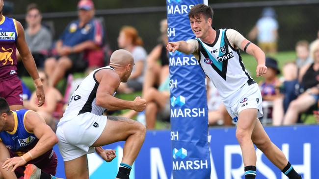 Zak Butters (right) credits his goal to Sam Powell-Pepper during Sunday’s match against the Lions. Picture: AAP Image/Darren England