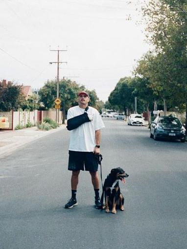 Powell-Pepper with his dog Abel. Picture: @sampowellpepper/Instagram