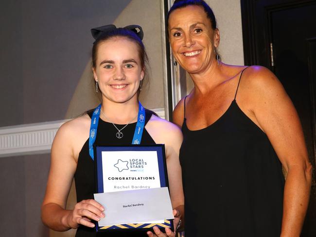 Rachel Bardney receiving her award from Netball NSW Hall of Famer Carissa Tombs. Picture: Damian Shaw