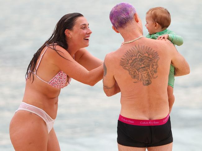 Flea says hello to a mum and her child. Picture: KHAP / BACKGRID