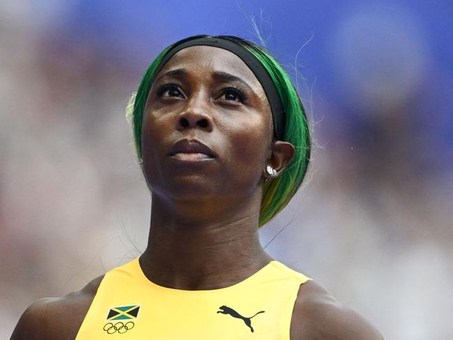 Jamaica's Shelly-Ann Fraser-Pryce reacts after competing in the women's 100m heat of the athletics event at the Paris 2024 Olympic Games at Stade de France in Saint-Denis, north of Paris, on August 2, 2024. (Photo by Jewel SAMAD / AFP)