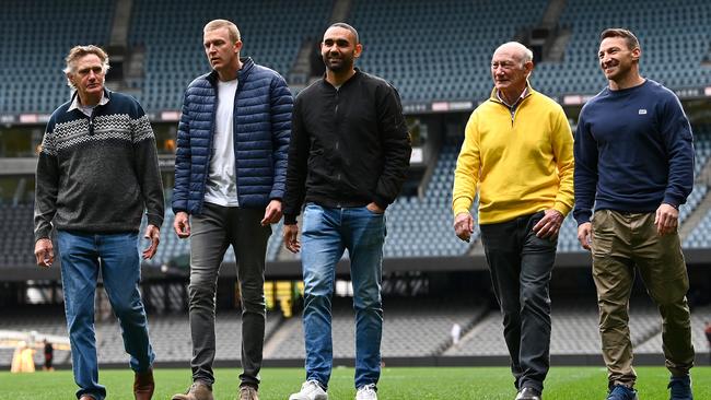 The 400 club ... Michael Tuck, Dustin Fletcher, Shaun Burgoyne, Kevin Bartlett and Brent Harvey at Marvel Stadium on Friday. Picture: Getty Images