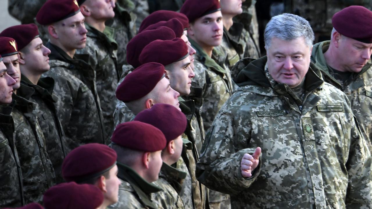 Ukrainian President Petro Poroshenko speaks to Ukrainian servicemen. Picture: AFP