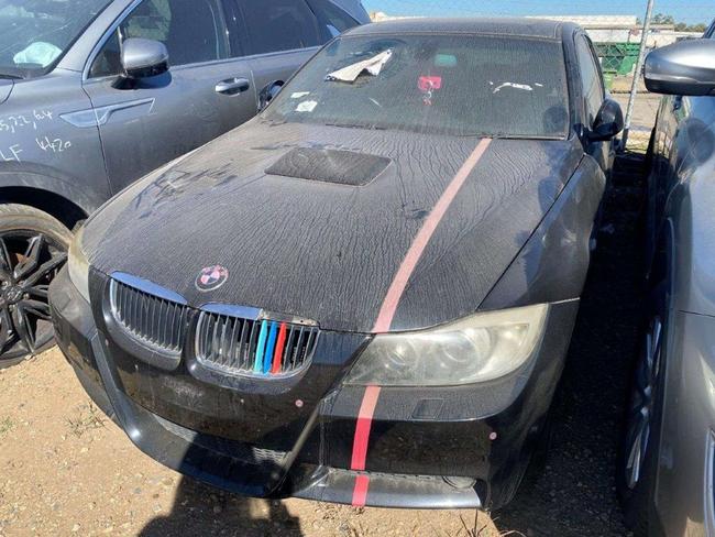 The abandoned 2007 black BMW Series 3 sedan.