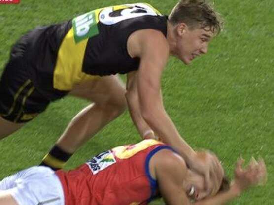 Tom Lynch pushes Alex Witherden's head into the ground.