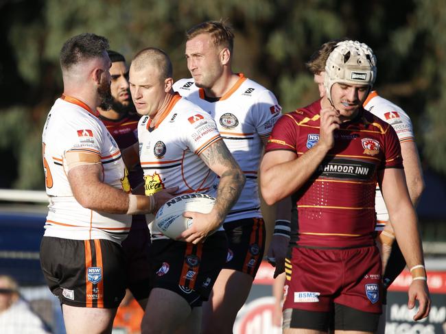Daniel Smith is congratulated after scoring for The Oaks. Picture Warren Gannon Photography