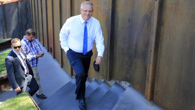 Prime Minister Scott Morrison scales the stairs at the Museum of Old and New Art at Berriedale on Monday. Picture: AAP/ROB BLAKERS