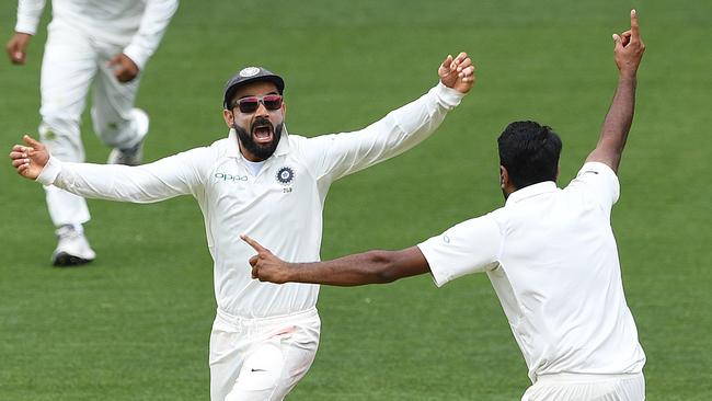 Indian captain Virat Kohli, left, reacts as India clinch victory. Picture: AAP