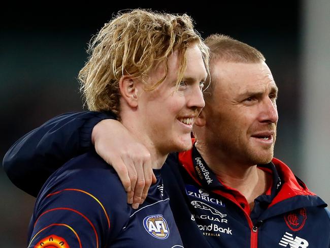 MELBOURNE, AUSTRALIA - SEPTEMBER 09: Clayton Oliver of the Demons and Simon Goodwin, Senior Coach of the Demons are seen during the 2022 AFL Second Semi Final match between the Melbourne Demons and the Brisbane Lions at the Melbourne Cricket Ground on September 9, 2022 in Melbourne, Australia. (Photo by Dylan Burns/AFL Photos via Getty Images)