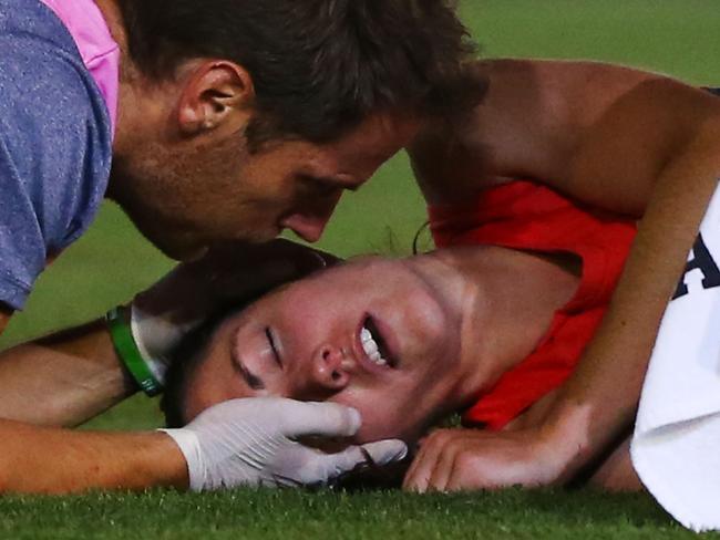 MELBOURNE, VICTORIA - FEBRUARY 11: Meg Downie of the Demons prepares to get stretchered off during the round two AFL Women's match between the Collingwood Magpies and the Melbourne Demons at Ikon Park on February 11, 2017 in Melbourne, Australia. (Photo by Michael Dodge/AFL Media/Getty Images)