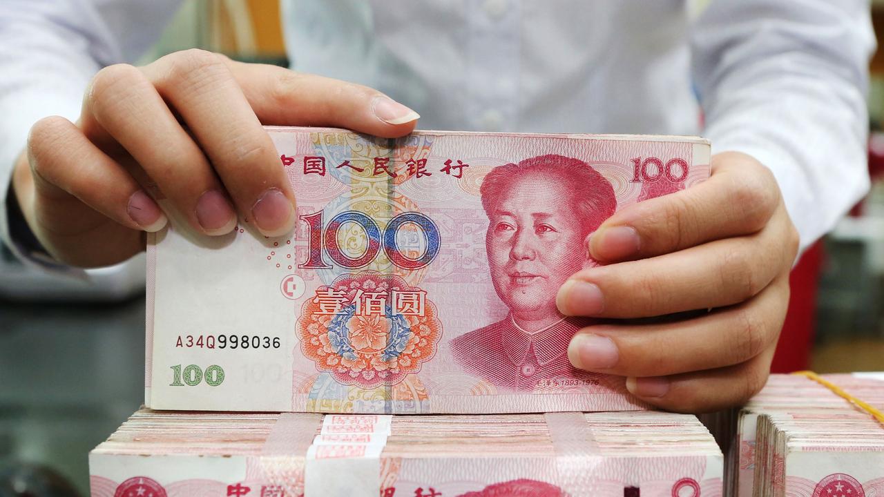 Chinese authorities are literally cleaning the country’s currency to stop the spread of the coronavirus. Picture: AFP