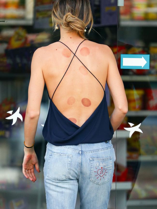 Jesinta sporting a nod to her fiance on her jeans. Picture: Getty