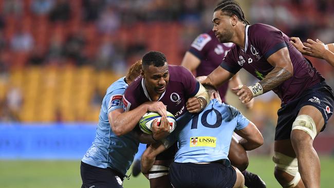 BRISBANE, AUSTRALIA - MAY 18: Samu Kerevi of the Reds is tackled during the round 14 Super Rugby match between the Reds and the Waratahs at Suncorp Stadium on May 18, 2019 in Brisbane, Australia. (Photo by Albert Perez/Getty Images)