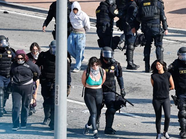 California Highway Patrol (CHP) officers detain protesters blocking the 101 freeway. Picture: Mario Tama/Getty Images/AFP