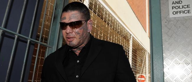 Jacques Teamo leaving the watch-house after the 2013 brawl. He was one of the Gold Coast’s most feared bikies at the time (AAP Image)