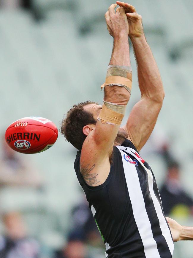 Travis Cloke fumbles a marking attempt.
