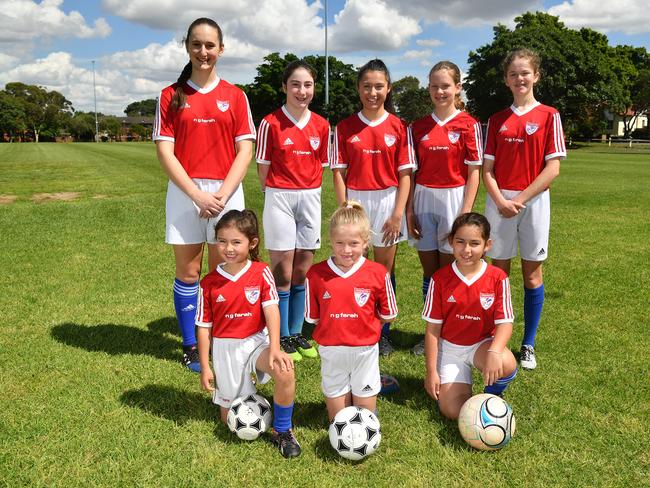 Pagewood Botany Football Club members pose for a photo at Jellicoe Park in Pagewood, Sydney, Saturday, Nov. 11, 2017. (AAP Image/Joel Carrett)