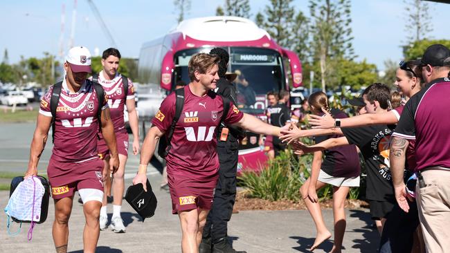 Queensland players arrive off the team bus. Picture Lachie Millard