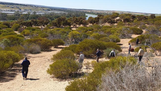 Police examine the Hells Angels’ property at Ponde during a search for evidence in two murder cases. Picture: SAPOL