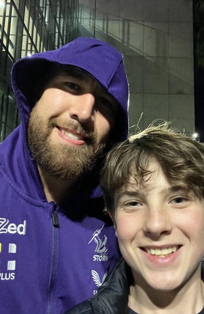 Nelson Asofa-Solomona spotted outside Suncorp Stadium with Tui Kamikamika and young fan Brandon O'Brien.