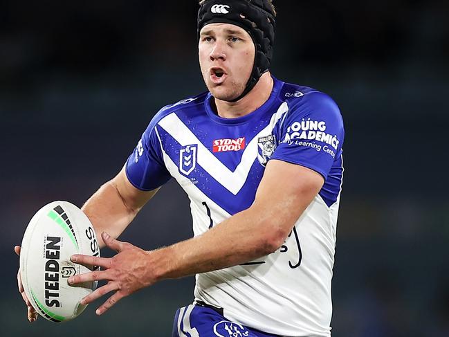 SYDNEY, AUSTRALIA - JULY 17:  Matt Burton of the Bulldogs runs with the ball during the round 18 NRL match between the Canterbury Bulldogs and the South Sydney Rabbitohs at Stadium Australia, on July 17, 2022, in Sydney, Australia. (Photo by Mark Kolbe/Getty Images)