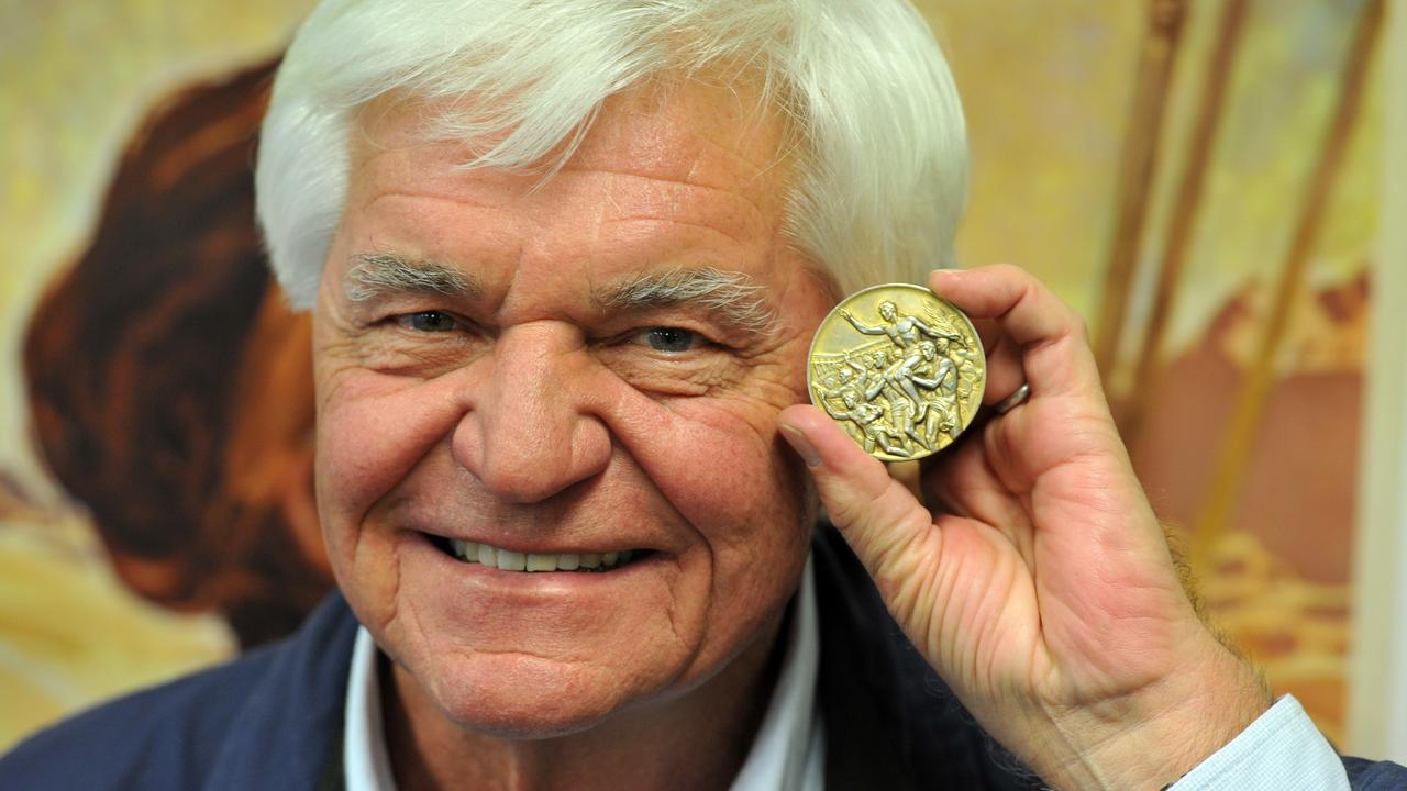 Olympic gold medallist John Konrads with his 1960 Olympic freestyle gold medal. Picture: AAP Image/Julian Smith