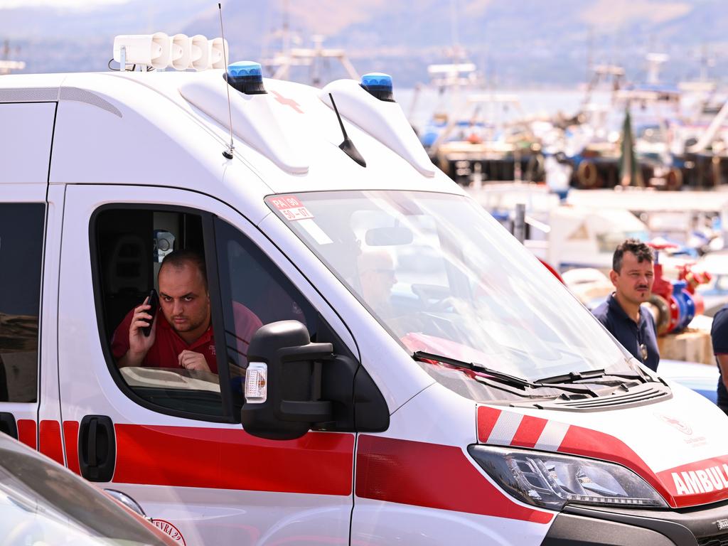 An ambulance is parked near the harbour where a search continues for missing passengers after a yacht capsized. Picture: Getty Images