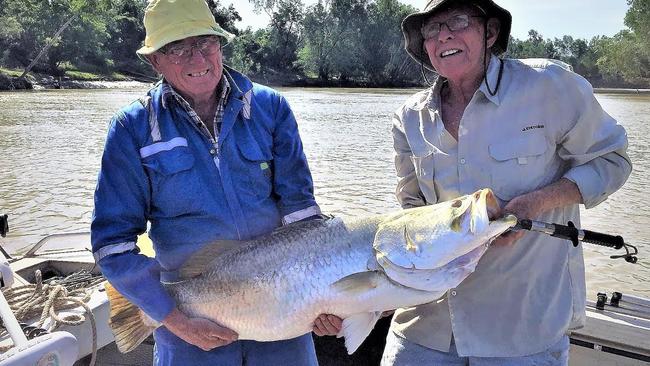 Terry Howard and Jim Motlock with a beautiful barra caught on the Daly River - successfully released