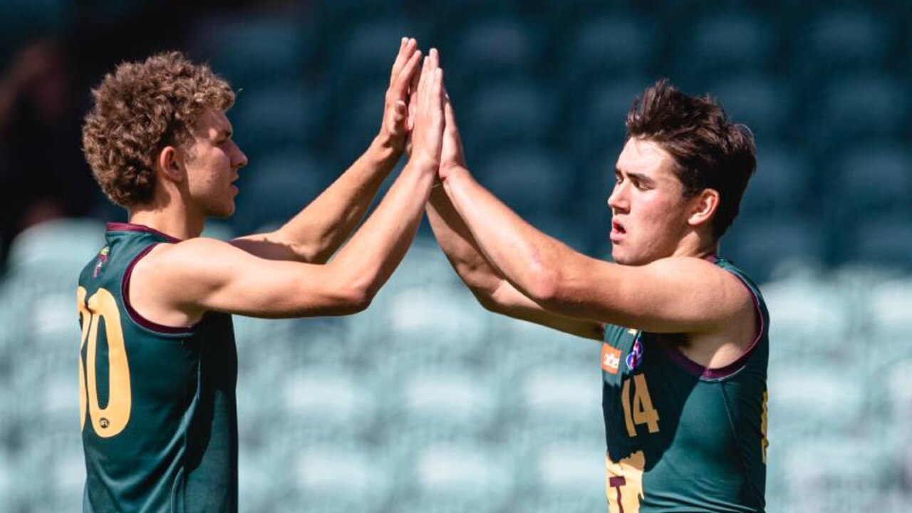 Tasmania Devils skipper Thomas Beaumont (right) celebrates a goal. Pic: Solstice Digital