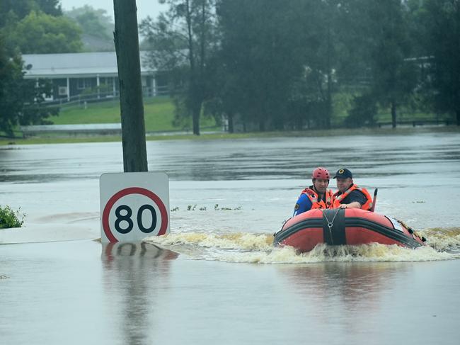 A SES boat patrols the flooded waterways of the Hawkesbury River in Vineyard. Picture: NCA NewsWire/Jeremy Piper