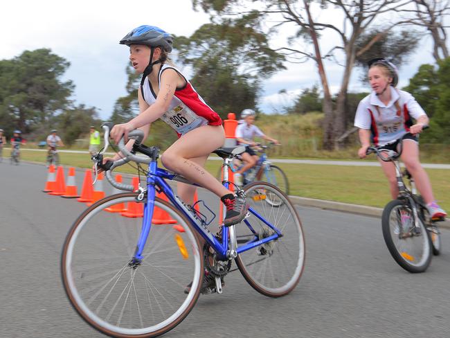 Mikayla Cooper, of Collegiate, competes in the bike leg of the grade 7 individual girls section.