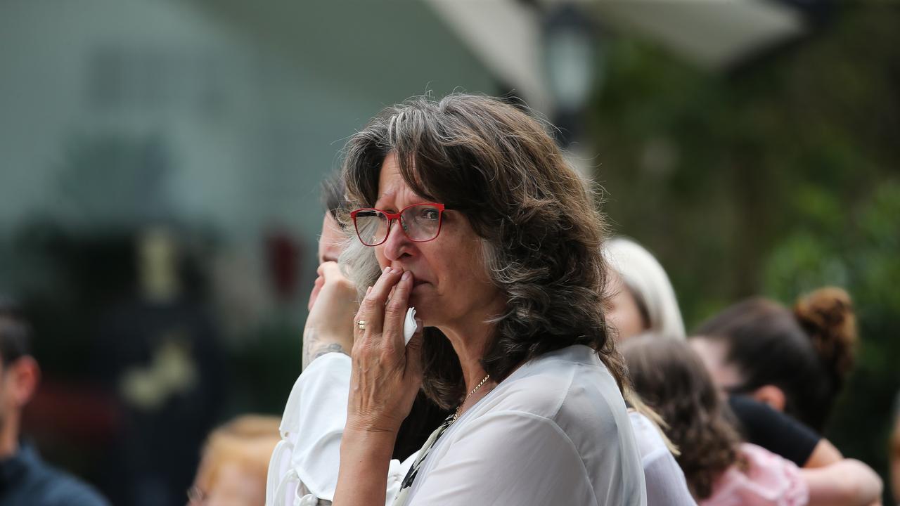 A woman appears teary-eyed as she arrives at St John the Beloved Church, Mt Druitt. Picture NCA Newswire / Gaye Gerard