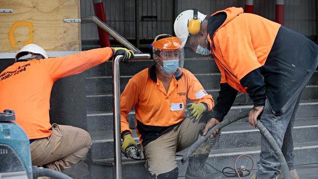 Tradies work on the Parramatta Light Rail on Thursday afternoon. Picture: Adam Yip