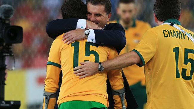 Ange Postecoglou hugs the injured star after the game.