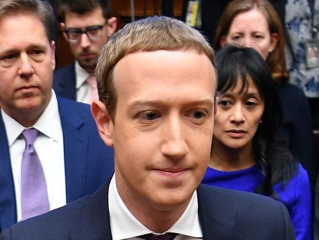 TOPSHOT - Facebook Chairman and CEO Mark Zuckerberg arrives to testify before the House Financial Services Committee on "An Examination of Facebook and Its Impact on the Financial Services and Housing Sectors" in the Rayburn House Office Building in Washington, DC on October 23, 2019. (Photo by MANDEL NGAN / AFP)