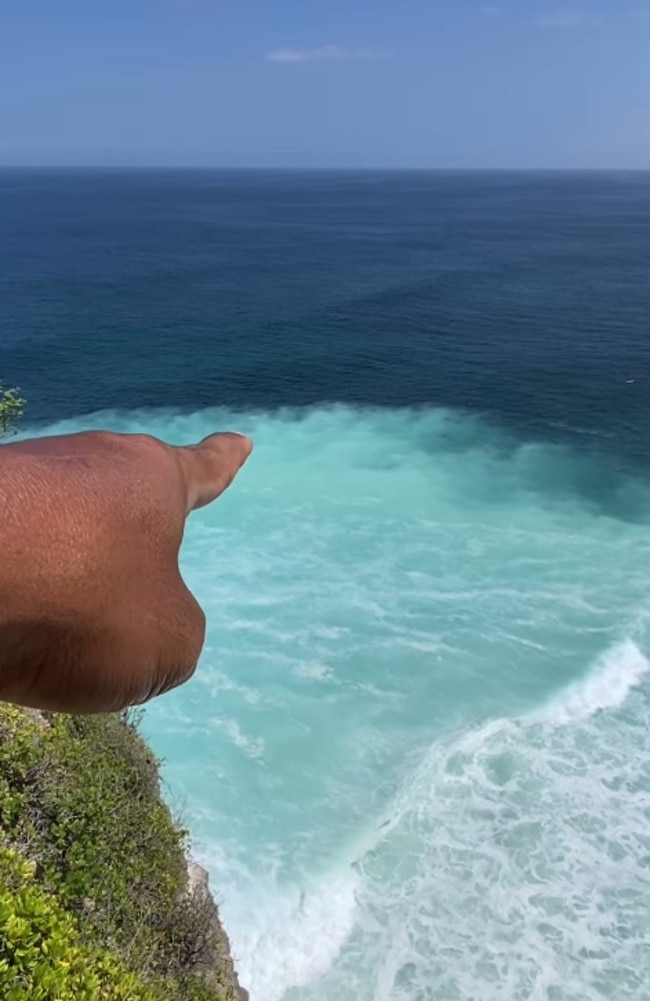 A Balinese local pointing at how the limestone has affected the ocean. Picture: Instagram/piterpanjaitan