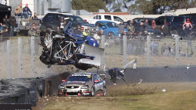 Todd Hazelwood’s Holden spins through the air after a heavy crash at turn six during the Sandown 500 last year.