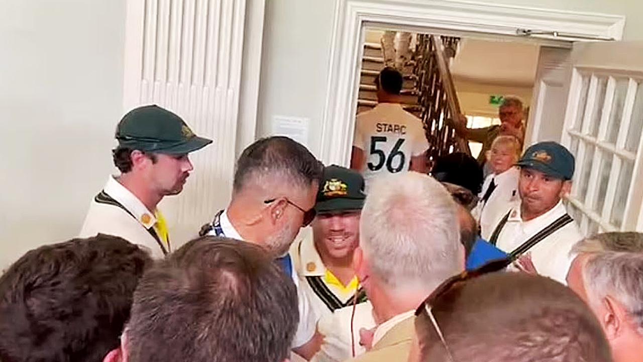 Usman Khawaja and Dave Warner in dispute with several MCC Members in the Long Room at Lords during the lunch break.