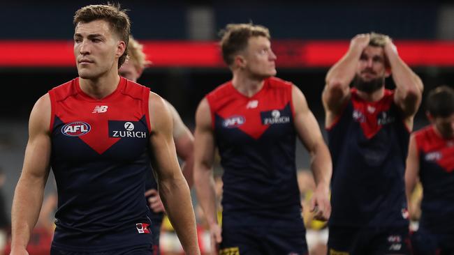 MELBOURNE, AUSTRALIA - JULY 05: The Demons look dejected following defeat in the round 5 AFL match between the Melbourne Demons and the Richmond Tigers at Melbourne Cricket Ground on July 05, 2020 in Melbourne, Australia. (Photo by Graham Denholm/AFL Photos via Getty Images)