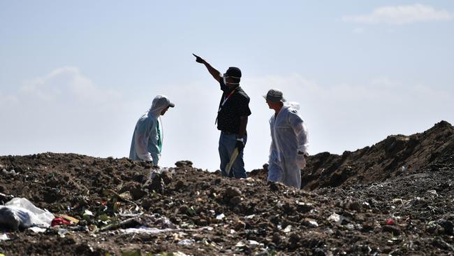 Forensic experts work at the crash site of an Ethiopian airways operated by a Boeing 737 MAX aircraft on March 16. Picture: AP