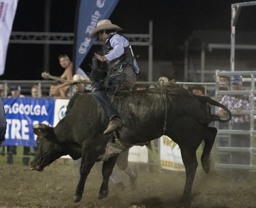 Tyson Smith rides in the open bullride at the Lawrence Twilight Rodeo. Picture: Adam Hourigan