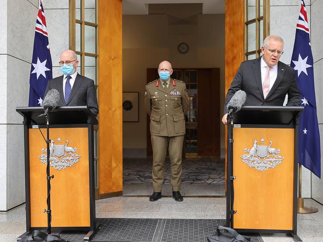 Prime Minister Scott Morrison at a press conference held at Parliament House in Canberra with COVID-19 Taskforce Commander, Lieutenant-General, John Frewen. Australia's Chief Medical Officer, Professor Paul Kelly. Picture: NCA NewsWire / Gary Ramage